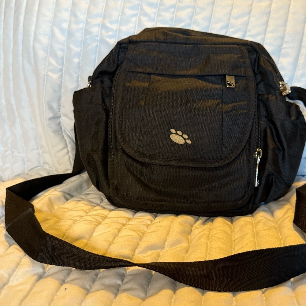 The BP Signature Petite Tote is a dog-themed crossbody bag from Black Paw